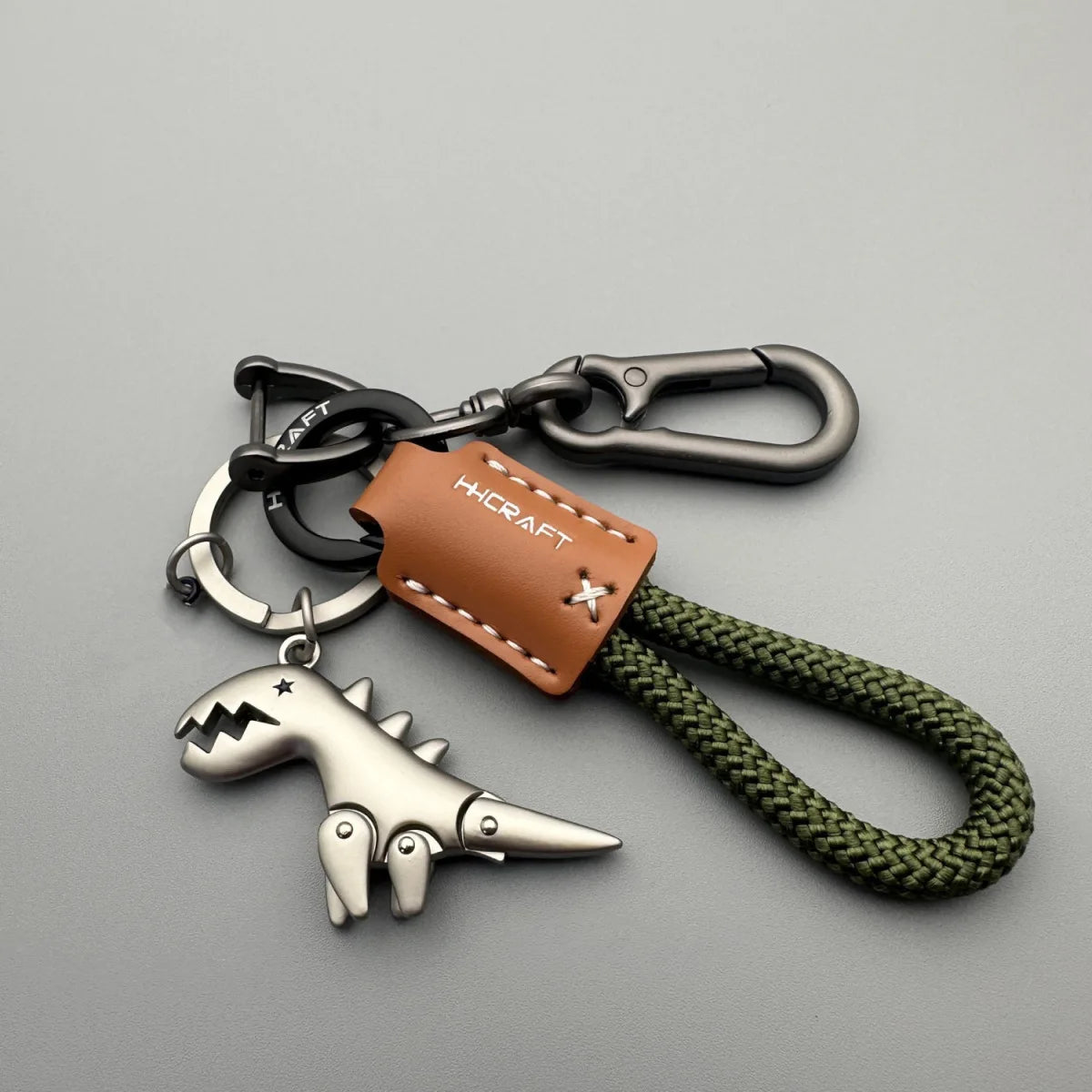Premium Woven Leather Metal Dinosaur Keychain for Motorcycle Car Handbag Backpack Pendant Gift Accessories with Bracelet